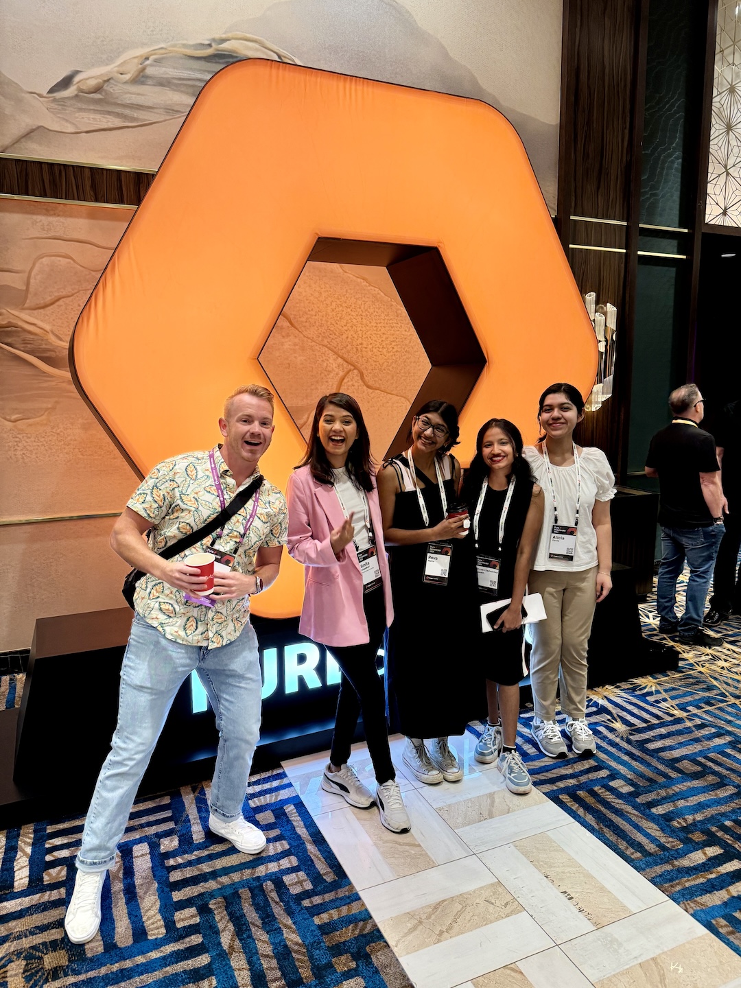 happy group of people smiling at event