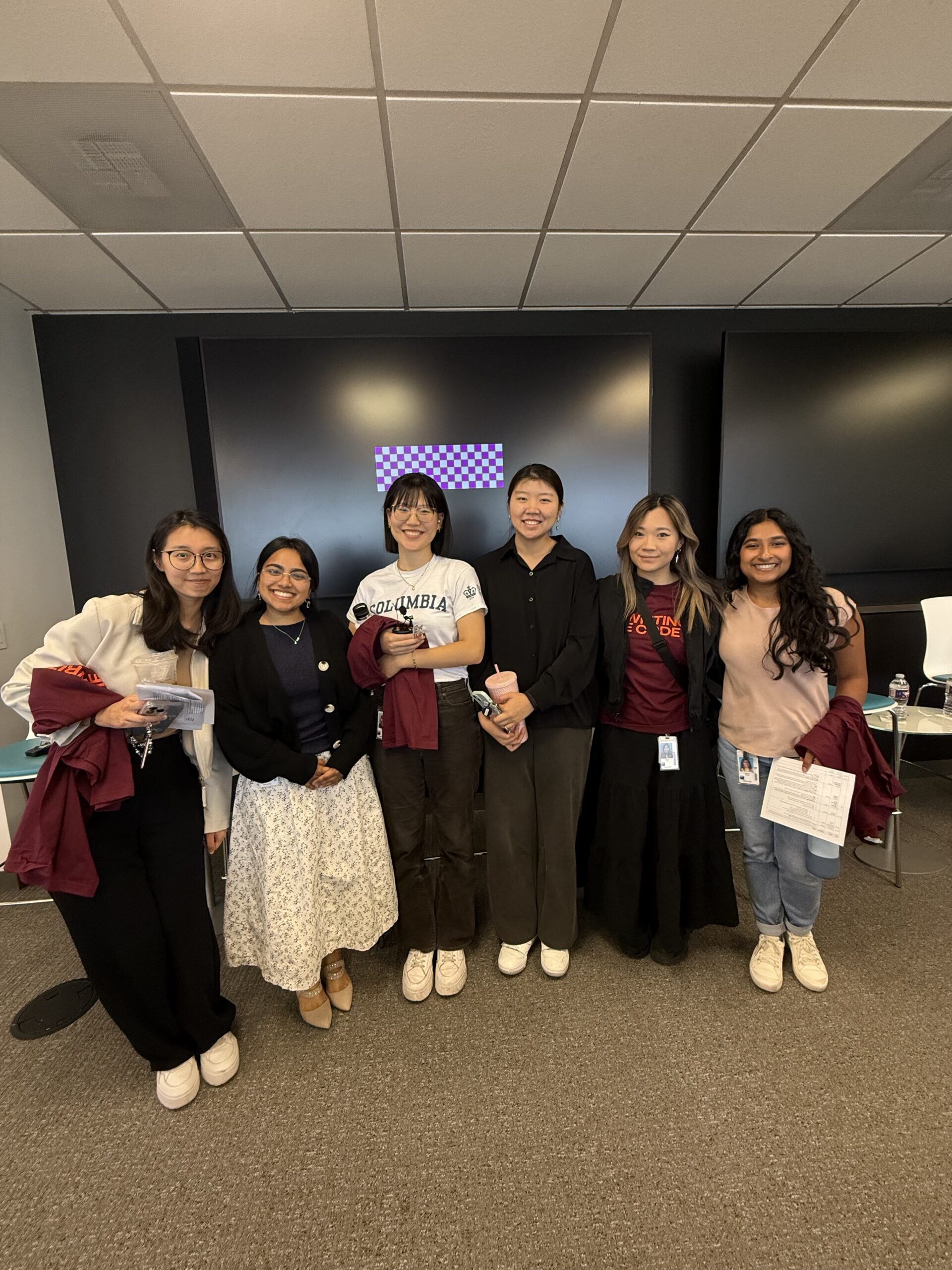 Early Career Panelists at GS Group of women smiling at a company event